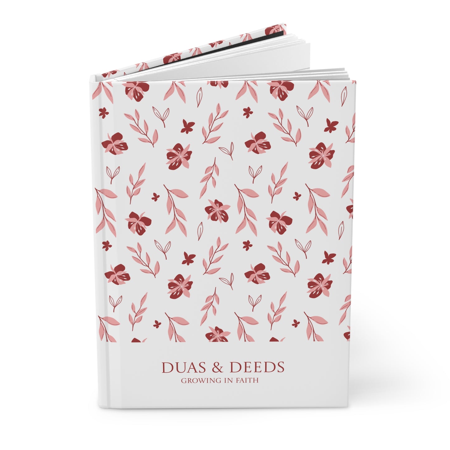 Angled view of floral pattern "Duas & Deeds" Muslimah journal on a white background.