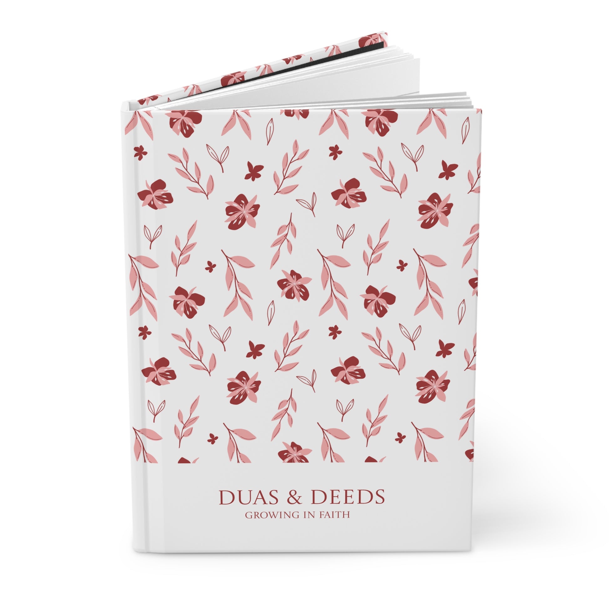 Angled view of floral pattern "Duas & Deeds" Muslimah journal on a white background.