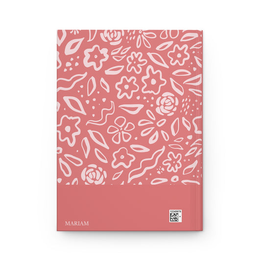 Muslimah journal with floral pattern on a pink back cover.