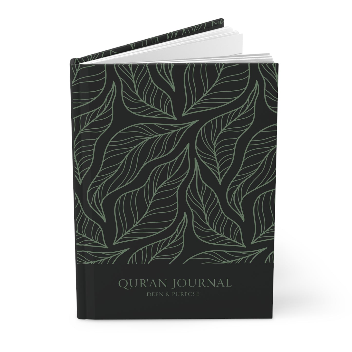 Angled view of a black Quran journal with sage green leaf pattern and hardcover finish.