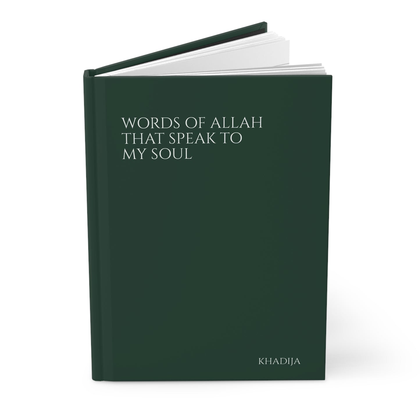 Angled view of a dark green Quran journal with smooth hardcover finish and simple text layout.