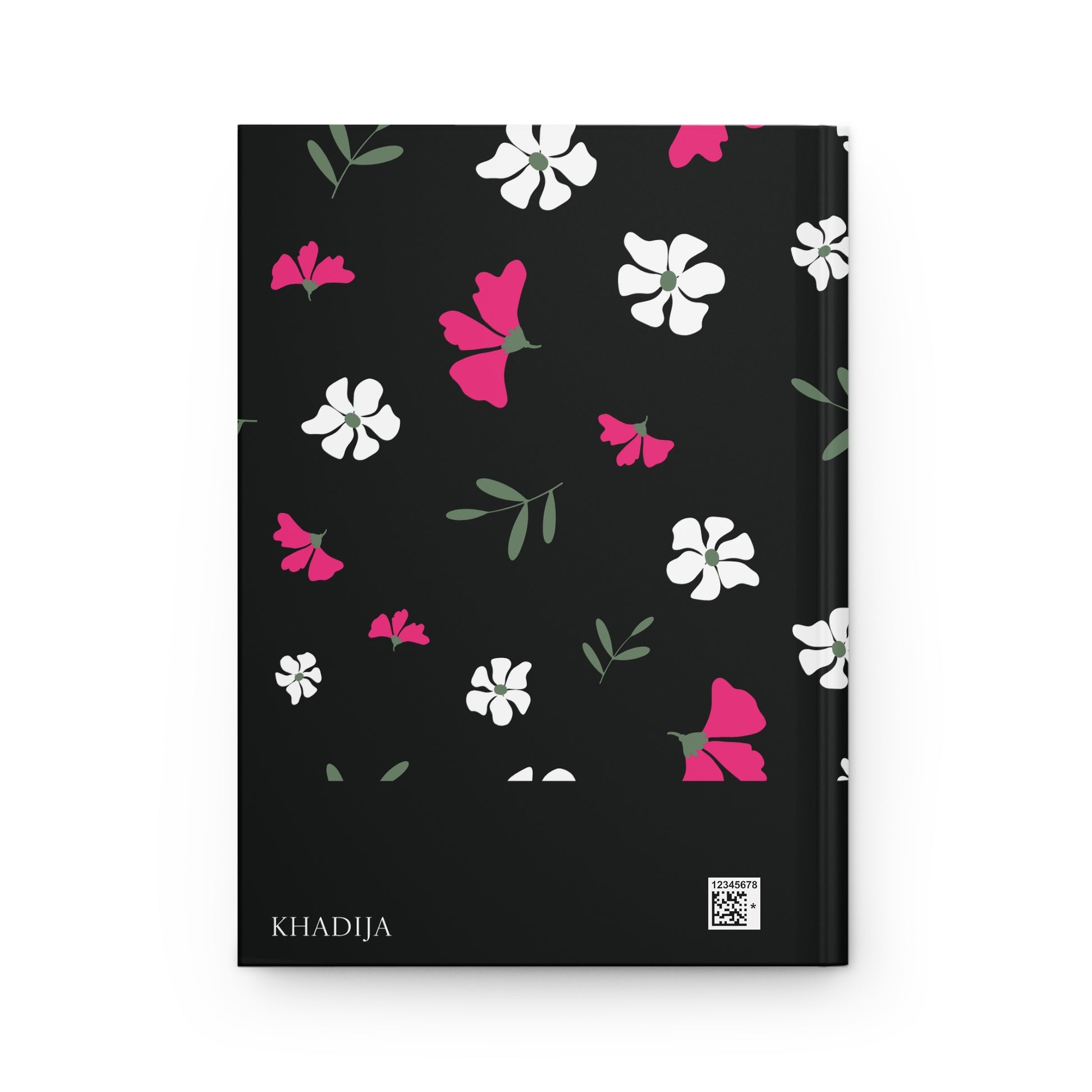 Back cover of a black Qur'an journal with simple floral artwork.