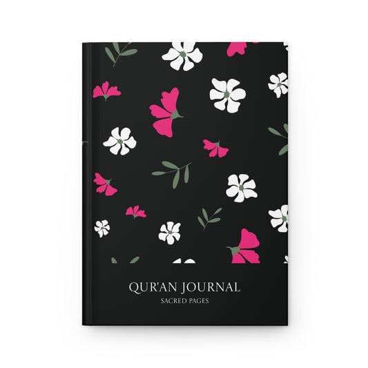 Front cover of a black Qur'an journal with pink and white floral pattern and Sacred Pages title.