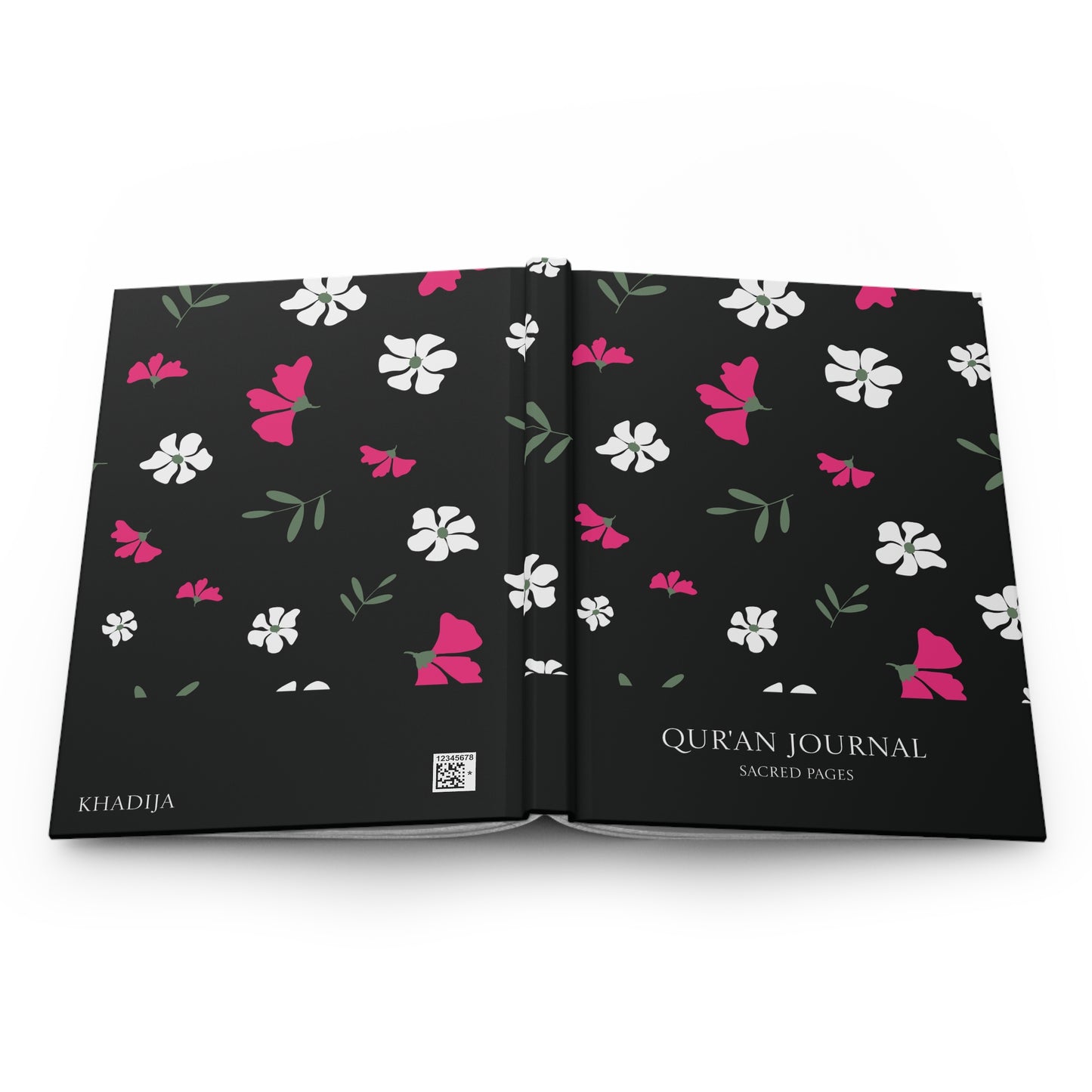 Full product view of a black Qur'an journal featuring pink, white, and green floral motifs.