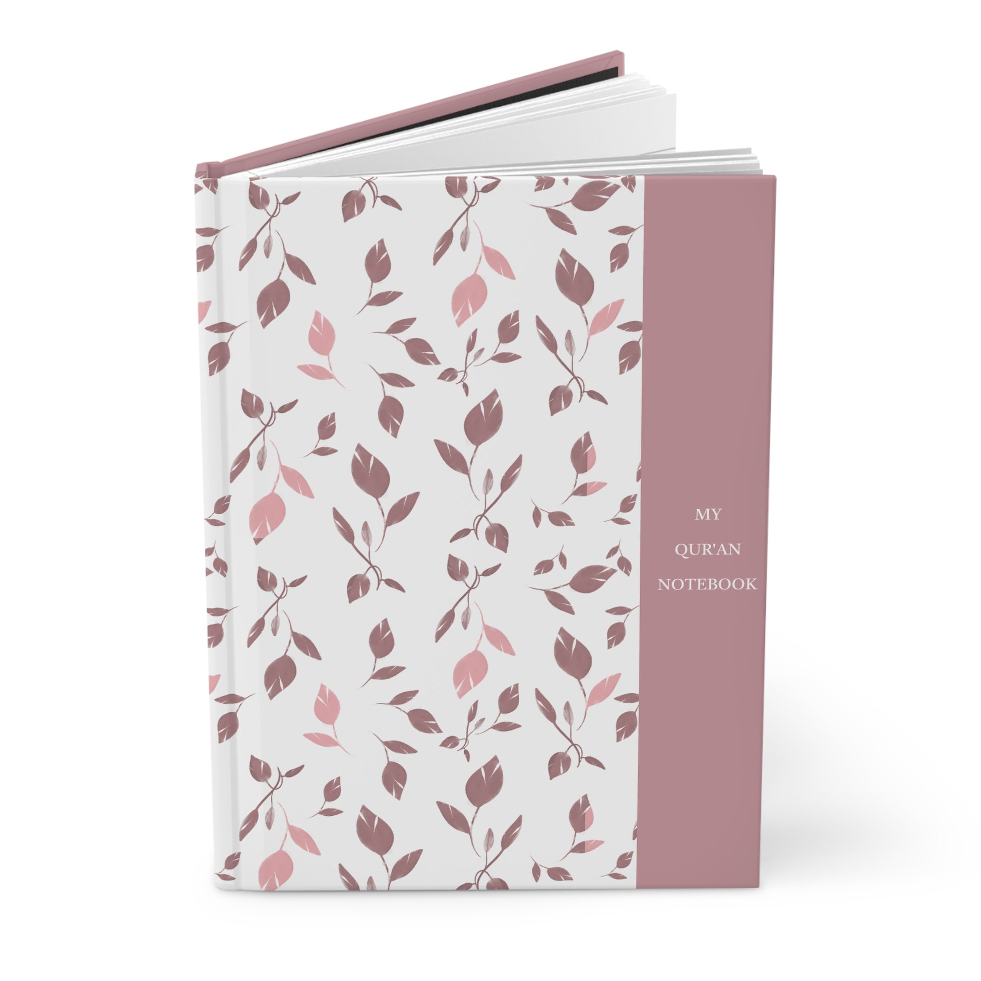 Angled view of a pink and mauve Quran notebook with hardcover finish.