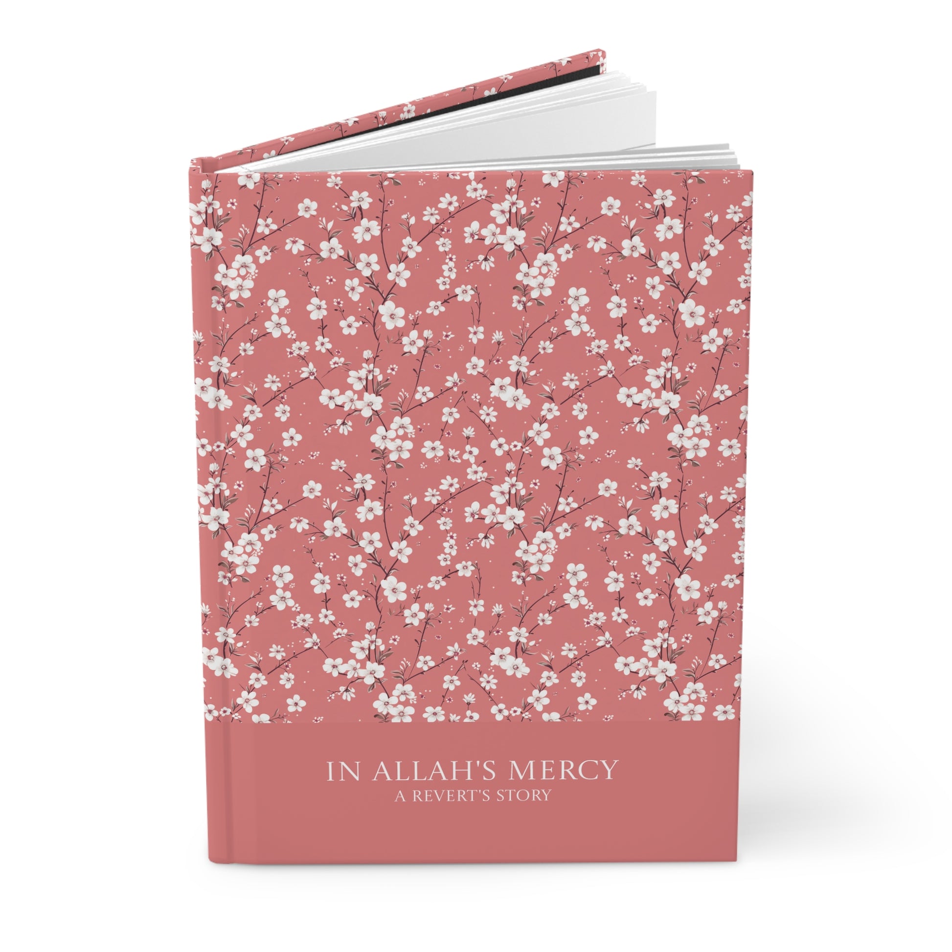 Angled view of a Revert journal with white floral pattern and hardcover finish.