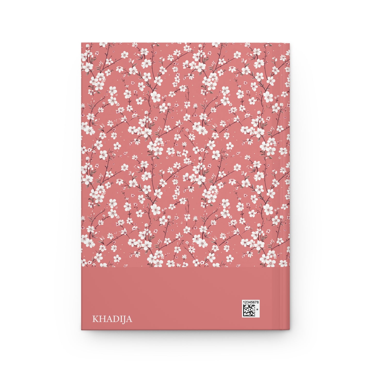 Revert journal with white floral pattern on a pink cover, with personalizable name 'KHADIJA' visible.