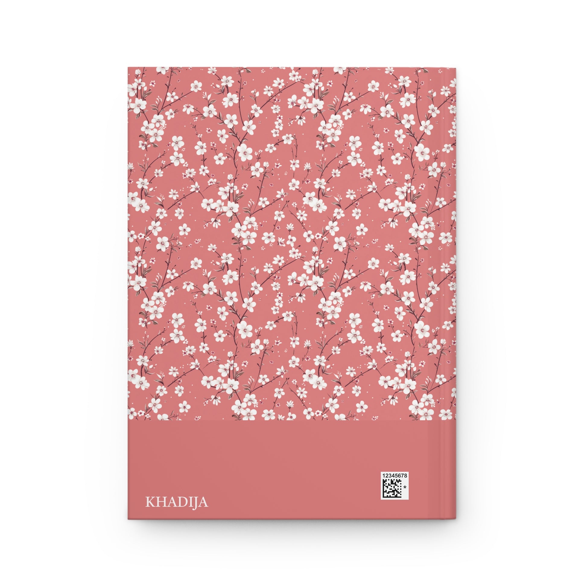 Revert journal with white floral pattern on a pink cover, with personalizable name 'KHADIJA' visible.
