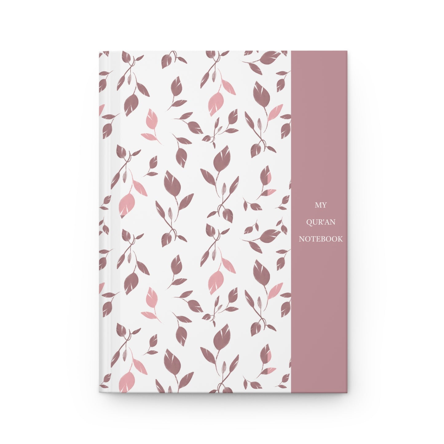Front cover of a Quran notebook with soft pink and mauve leaf pattern and minimalist title panel.