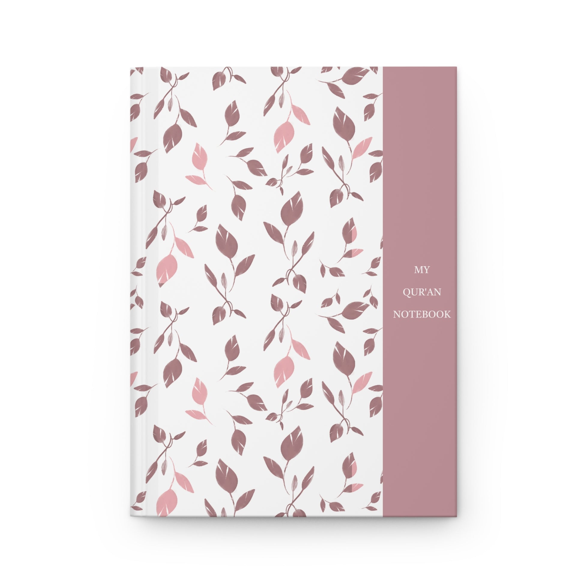 Front cover of a Quran notebook with soft pink and mauve leaf pattern and minimalist title panel.