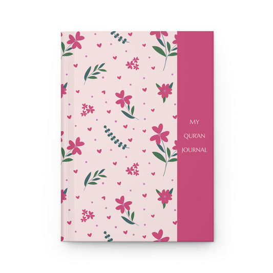 Floral design Quran journal with pink and green patterns on a white background
