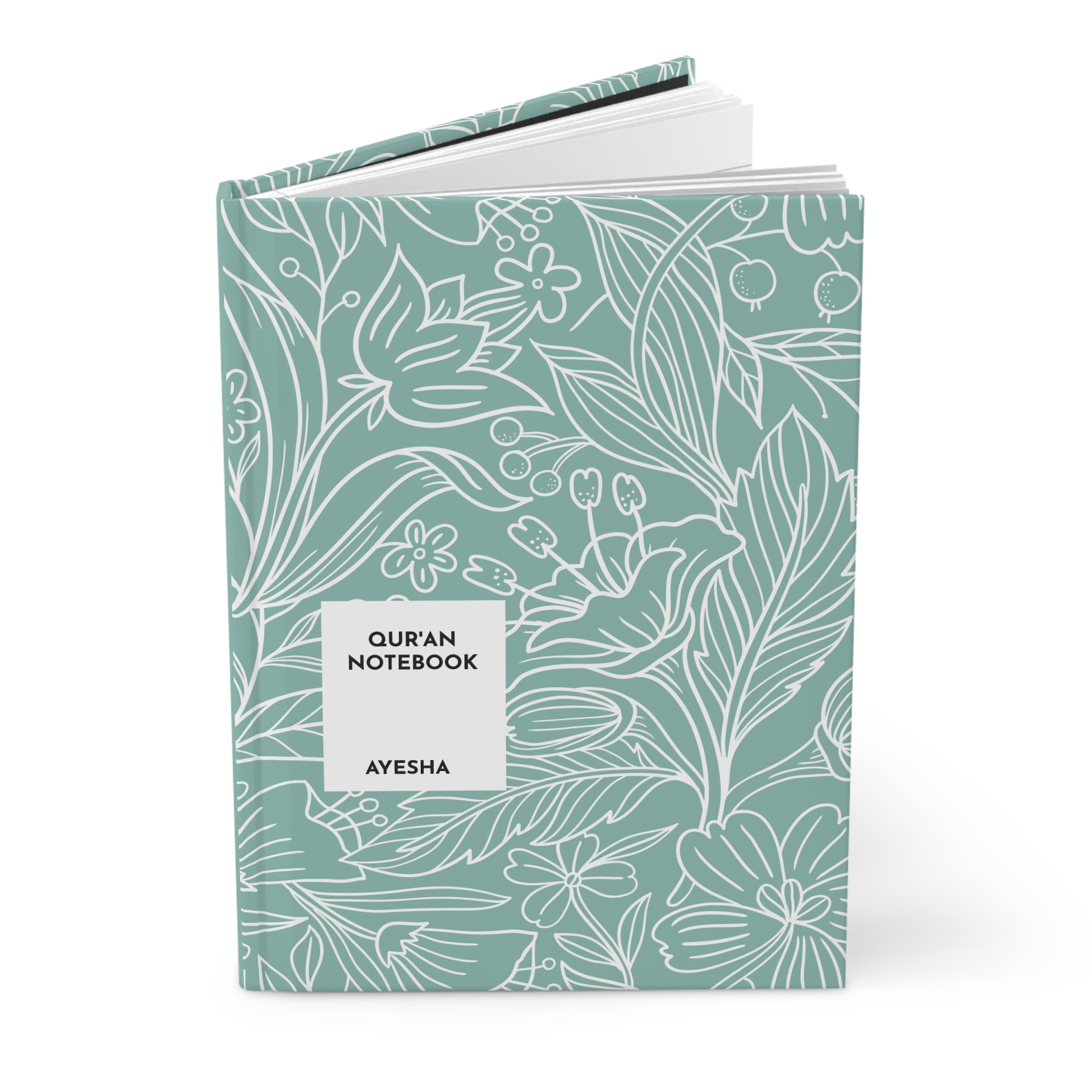 Personalized Quran journal upright and slightly open